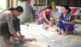 Women engaged in producing bamboo products