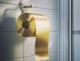 Toilet Paper Man’s Golden Offering