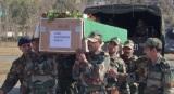 The body of Lance Naik being carried away by his fellow soldiers