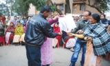 Protestors showing their disappointment by burning the Lokayukta bill.