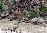 Makeshift bridges to cross torrential waters