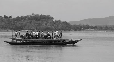 Pic: People boarding ferries to cross the River Brahmaputra.