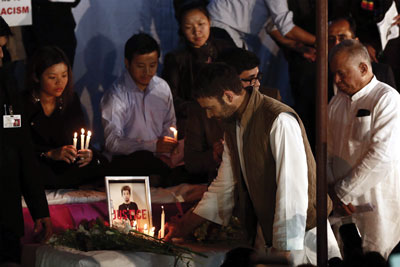 Rahul Gandhi lighting a candle for Nido Tania