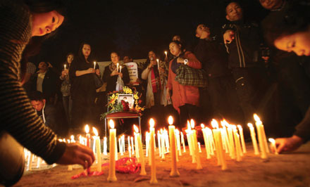 Candles lit in memory of Nido Tania