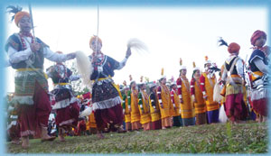 The dancers both males and females are attired in gold and silver ornaments of vintage design.