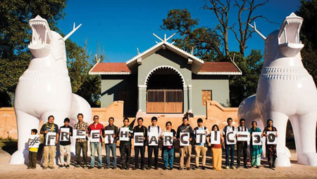 Cycle enthusiasts in front  of the historic Kangla